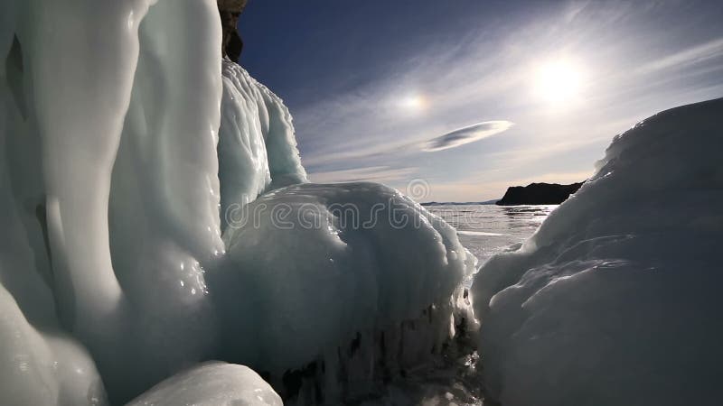 Big icicles on the rock on frozen lake baikal.