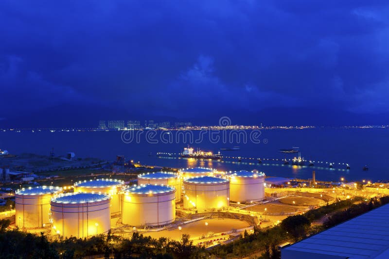 Big Industrial oil tanks in a refinery at night