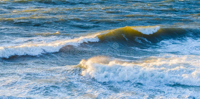 Big Ocean Waves Glowing in Sunset. Stock Image - Image of yellow, green