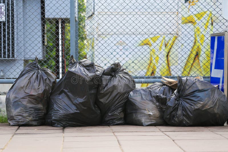 Pile Of Black Garbage Bag On The Street Stock Photo, Picture and Royalty  Free Image. Image 39347140.