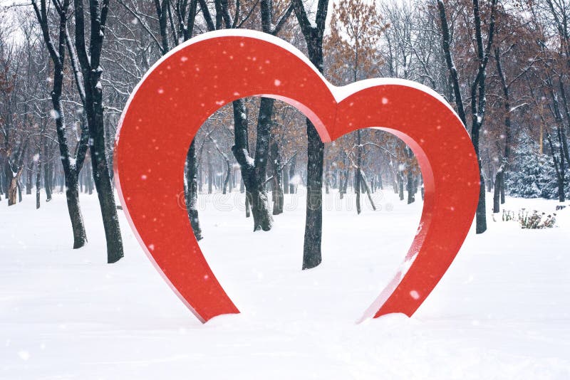 Big Red Heart street installation in winter park. Valentine&x27;s Day, love, romance background