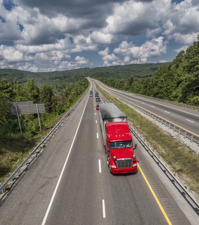 Big Red Truck On Long Mountain Highway