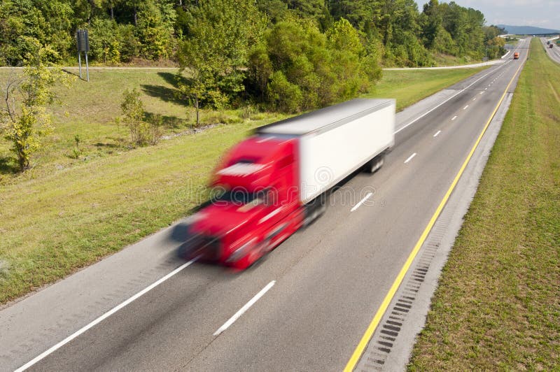 Big Red Truck Speeding Down Highway