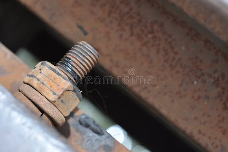 Big rusty metal nut locked with rust and corrosion bolt, Industrial bolt and nut