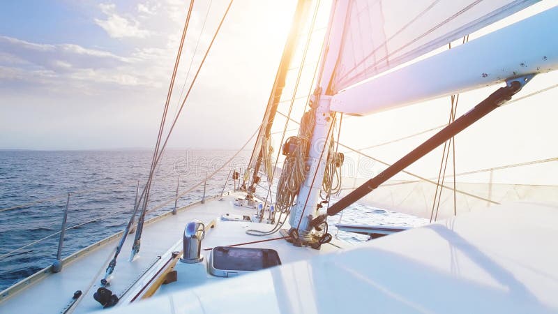 Big sailing yacht boat driving thru the ocean on a sunny day