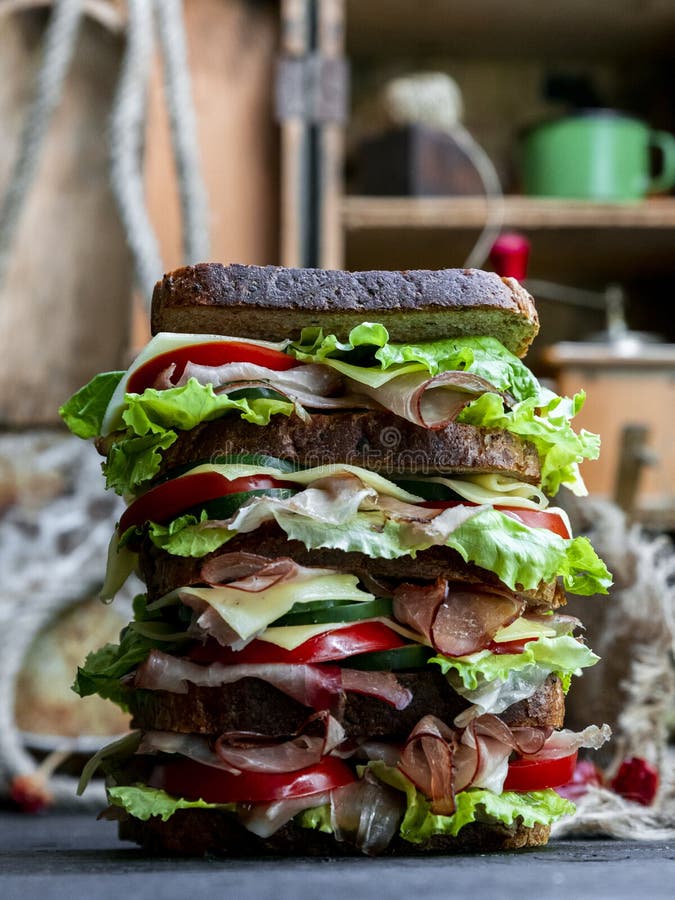 Sandwich with Bread, Prosciutto, Lettuce, Tomtatoes, Cucumber and