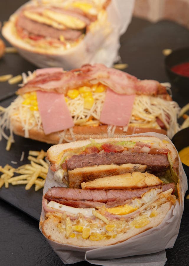 Big Sandwich with Various Kinds of Meat and Corn and Some Burgers Around Stock Image Image of