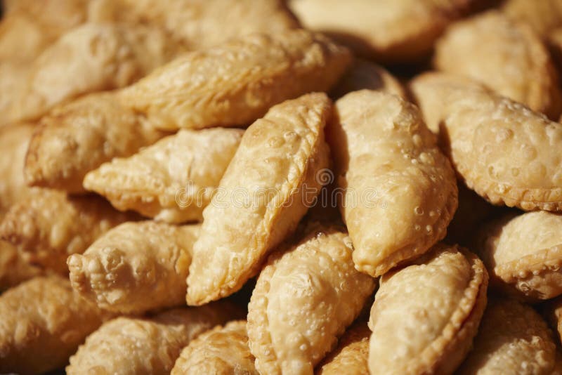 Big serving of curry puffs. Conceptual image stock photography