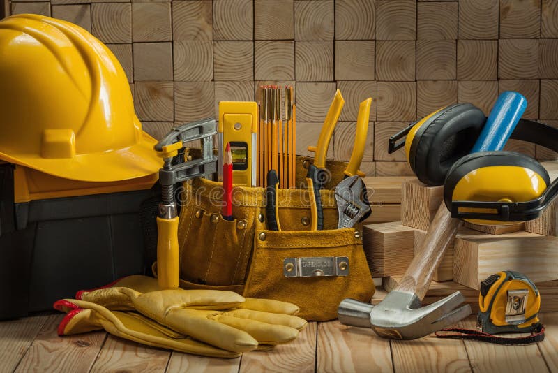 Big set of construction carpentry tools on wooden background
