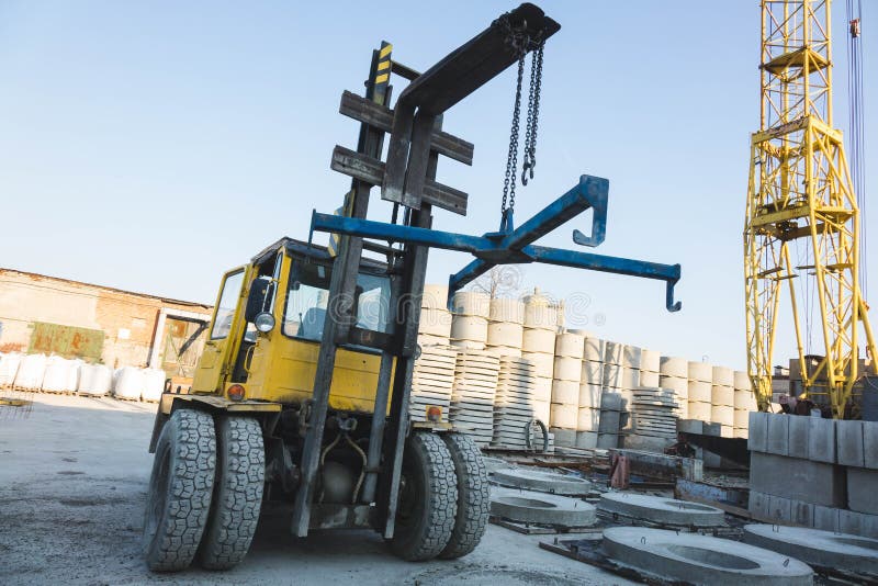 Big Spiked Wheels of Yellow Tractor Durable Rubber Tires Stock Photo