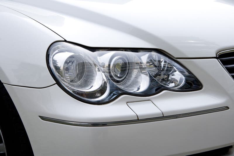 The Big Spotlight of a White Car. Stock Photo Image of auto