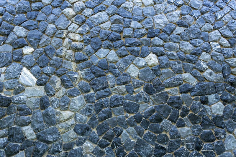 A big stone wall fixing together by cement the wall is same as castle base or some ancient wall in the past created pattern textur royalty free stock photos