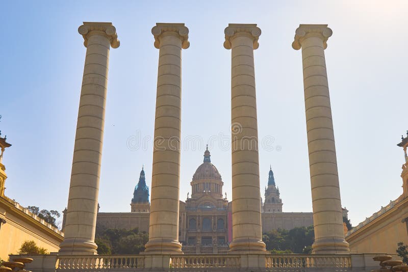 Big, strong stone columns on the street in Barcelona in Spain, hill Montjuic. In a background the National Museum of Catalonia