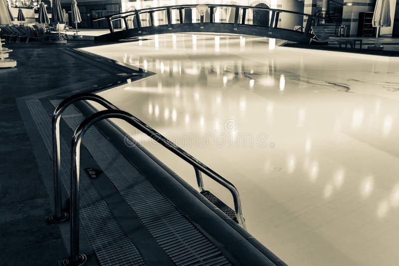 Big swimming pool with night lighting. North Cyprus monochrome background