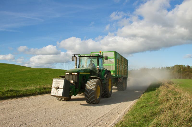 Big tractor on the road. stock photo. Image of spring 45478872