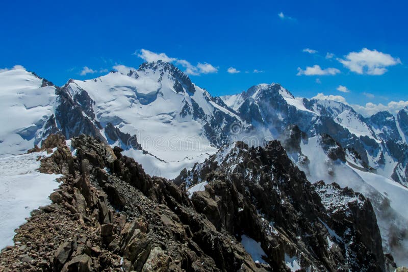 High mountain wall of Tian Shan, snow and glacier ice of Free Korea peak in Ala Archa