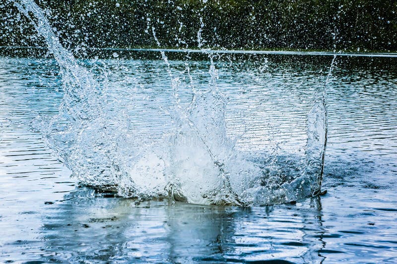 A big water splash in the blue water