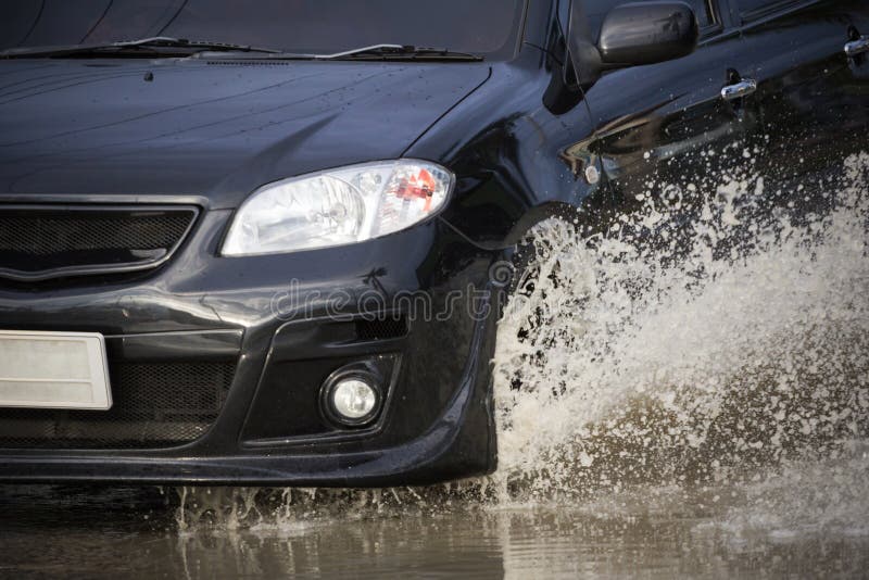 Water Splash with Car on Flooded Road after Rains Stock Photo Image