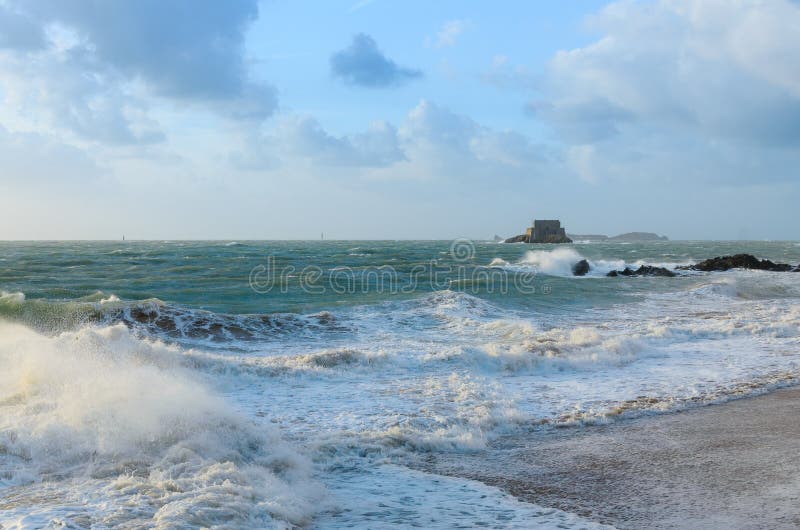 Big Waves and Little Fortress Petit Be in Saint Malo Stock Photo