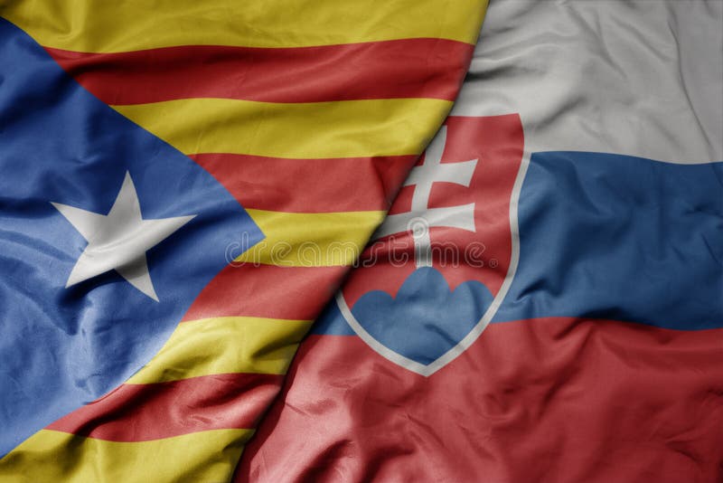 Big waving national colorful flag of catalonia and national flag of slovakia