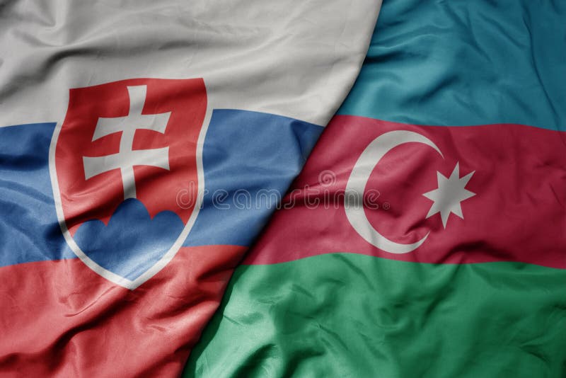 Big waving national colorful flag of slovakia and national flag of azerbaijan