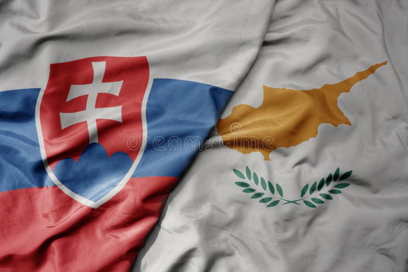Big waving national colorful flag of slovakia and national flag of cyprus