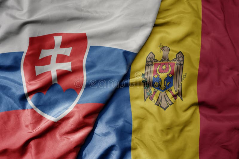 Big waving national colorful flag of slovakia and national flag of moldova