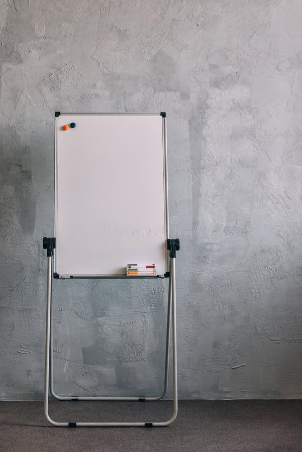 Big white board markers on grey background