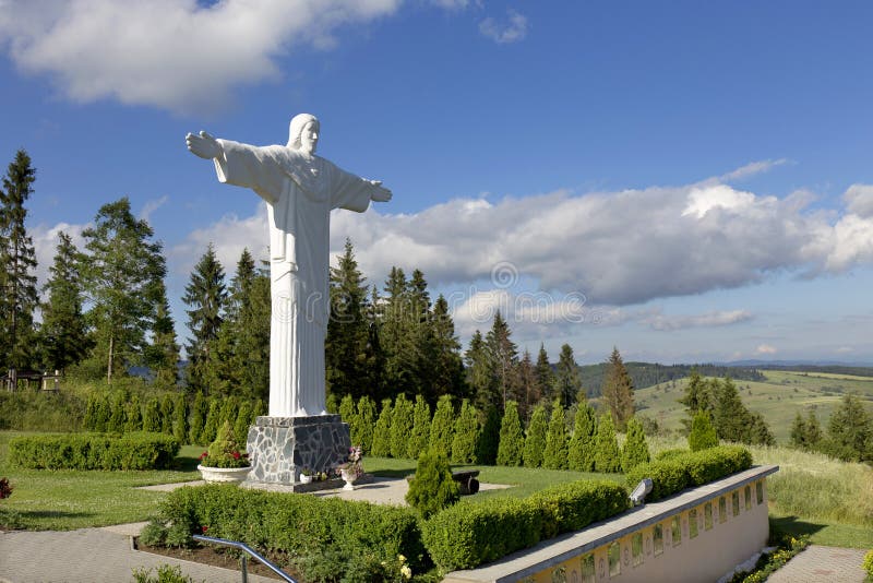 Big white Statue of Jesus over Landscape, Klin, Slovakia