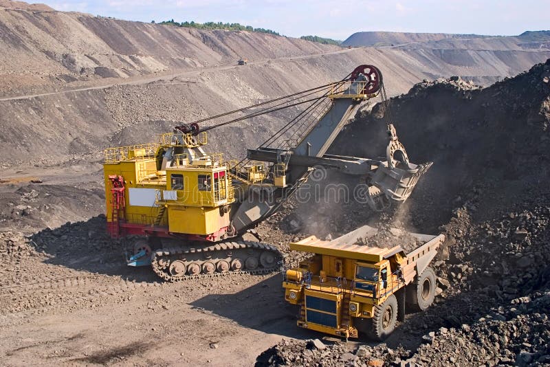 A picture of a big yellow mining truck at worksite