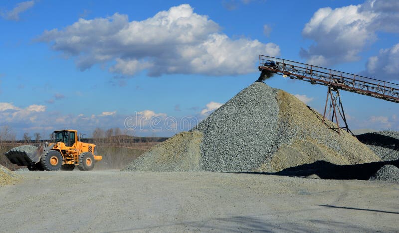 Big yellow mining truck in quarry