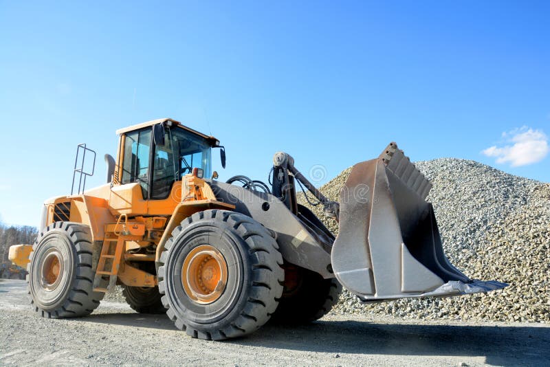 Big yellow mining truck in quarry