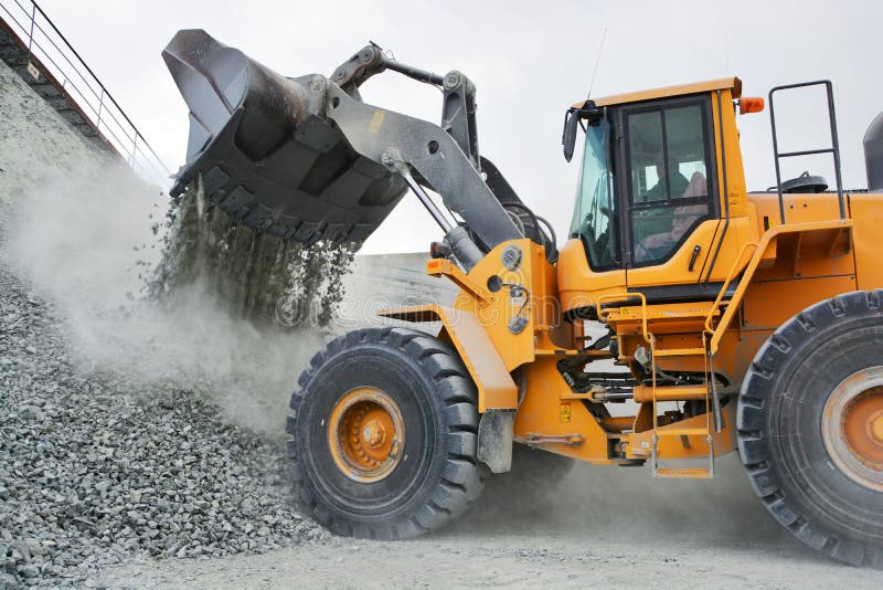 Big yellow mining truck in quarry