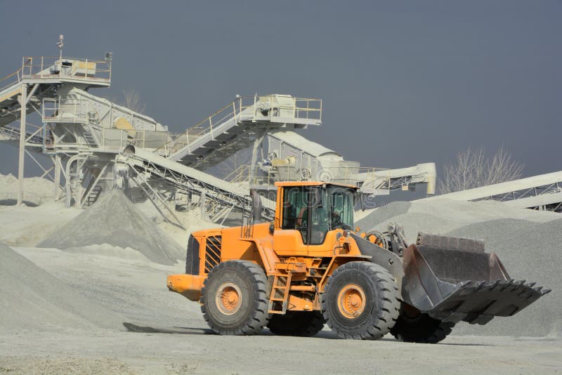 Big yellow mining truck in quarry