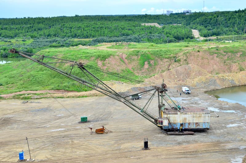 Biggest excavator dragline with a large bucket for the quarry overburden stripping. stock photo