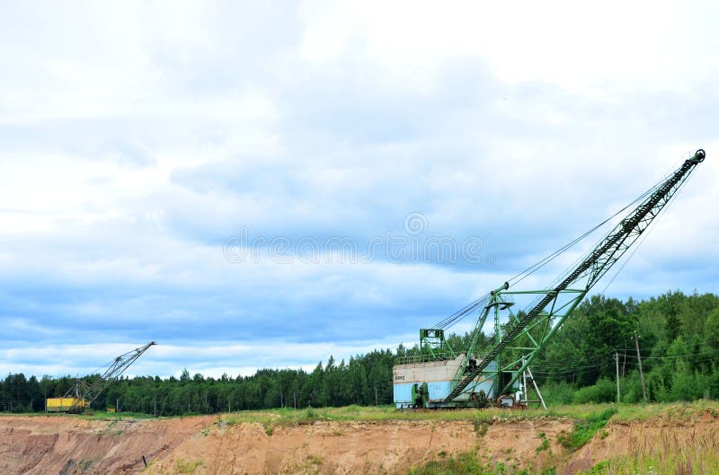Biggest excavator dragline with a large bucket for the quarry overburden stripping. royalty free stock photography
