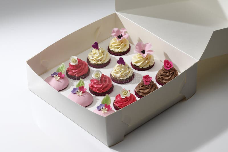 White box with twelve assorted cupcakes. White box with twelve assorted cupcakes