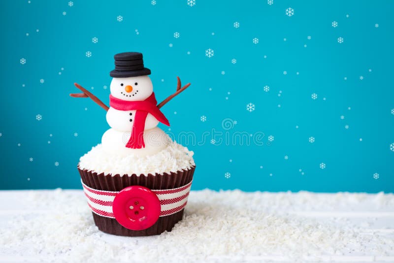 Cupcake decorated with a fondant snowman. Cupcake decorated with a fondant snowman