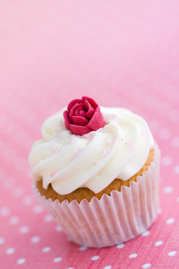 Mini cupcake decorated with a sugar rose. Mini cupcake decorated with a sugar rose