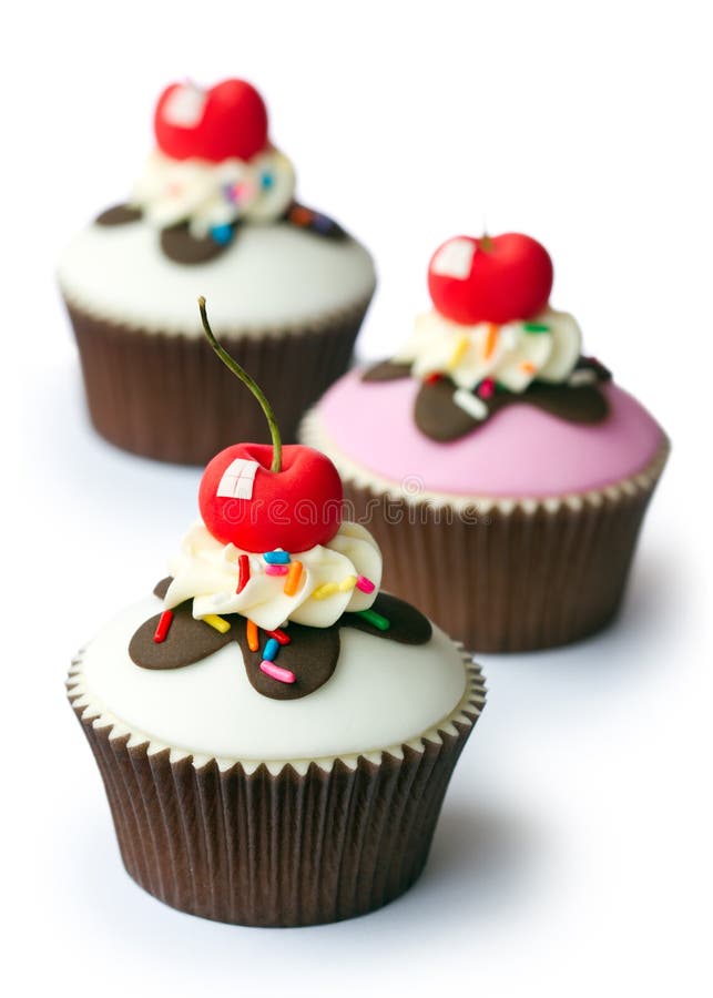 Cupcakes decorated with fondant cherries. Cupcakes decorated with fondant cherries