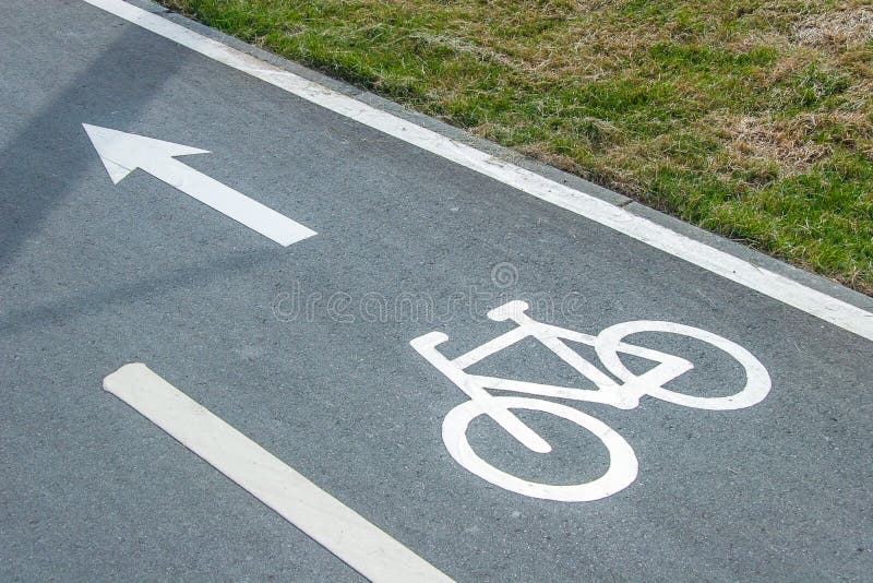 Bike lane sign on asphalt