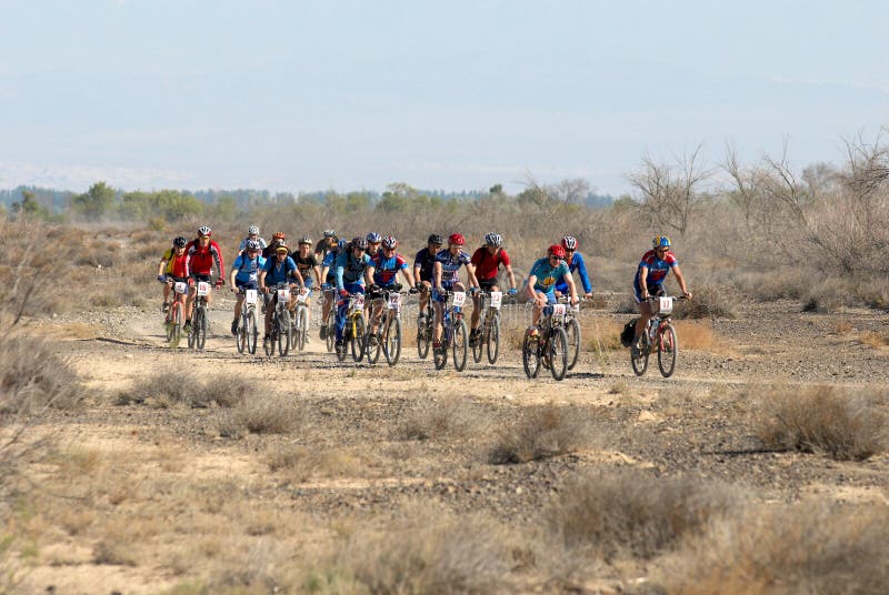 Bike race on desert road editorial photography. Image of bike 5217942