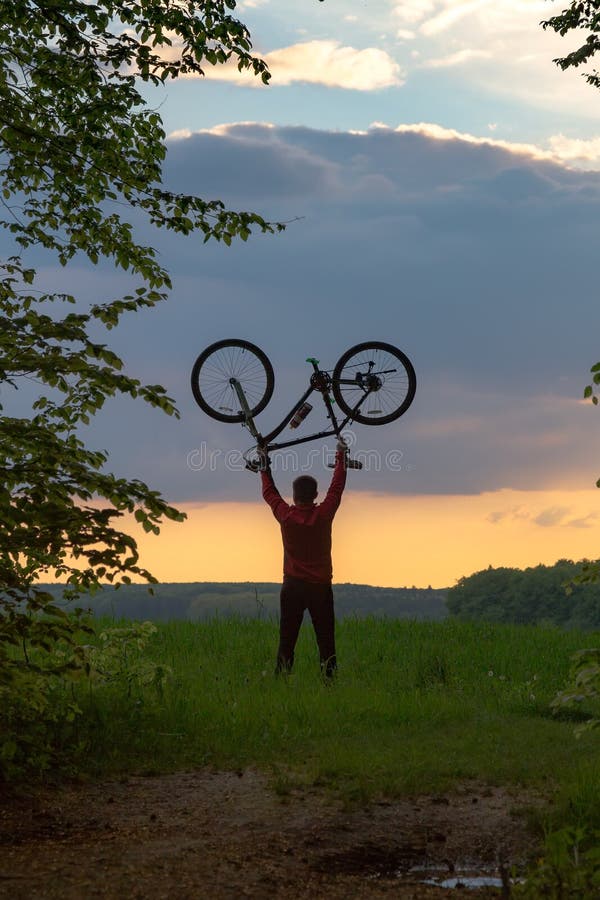 Biker Holding His Bike Upside Down Stock Photo Image of biking, dawn