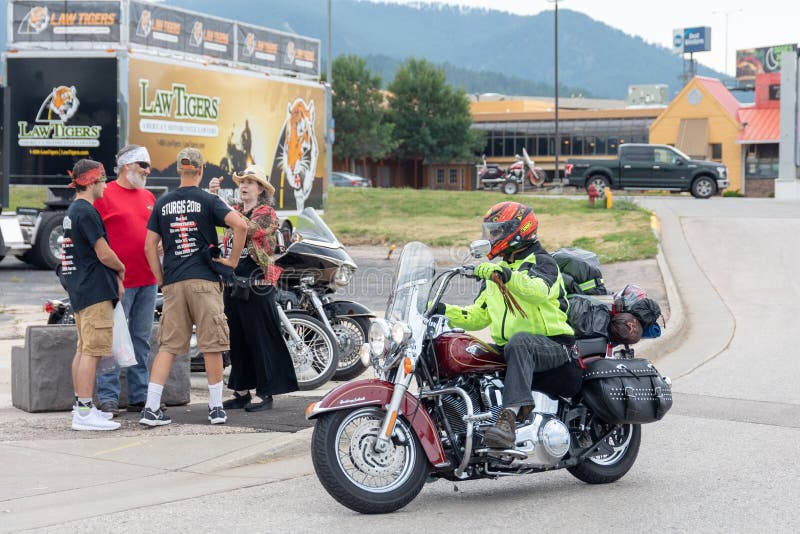 Biker rides into town for Sturgis Motorcycle Rally. stock photos Biker rides into town for Sturgis Motorcycle Rally. stock photos