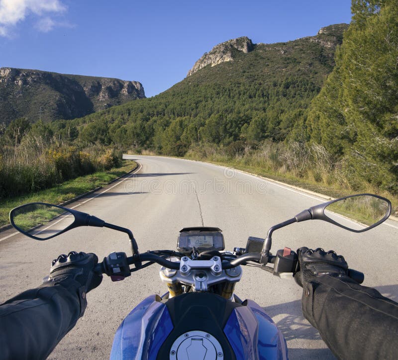 Biker on the road stock photo Biker on the road stock photo