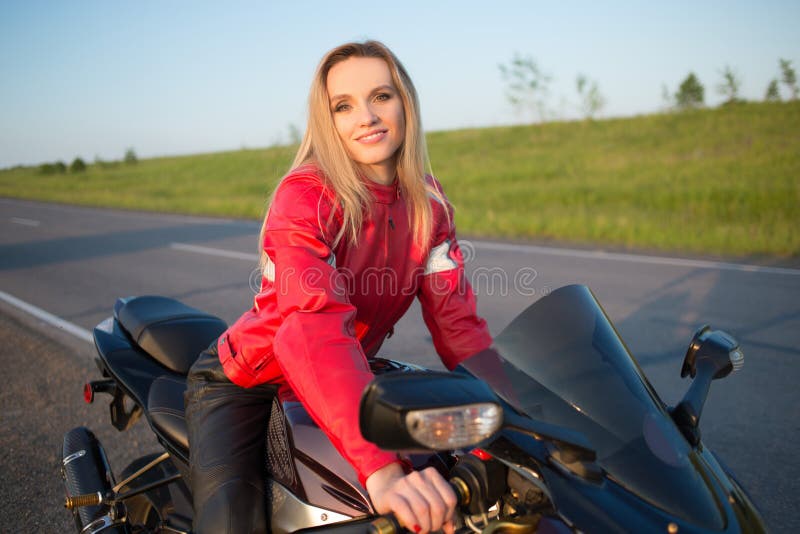 Biker woman sitting on a motorcycle stock images Biker woman sitting on a motorcycle stock images