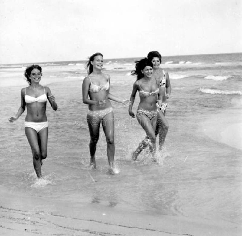 Bikini models running on the beach: Pensacola, Florida royalty free stock p...