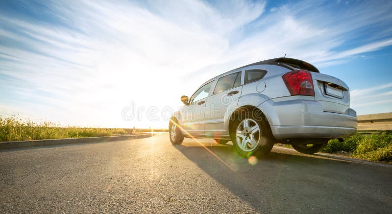 Gray car on road over sunny day. Gray car on road over sunny day