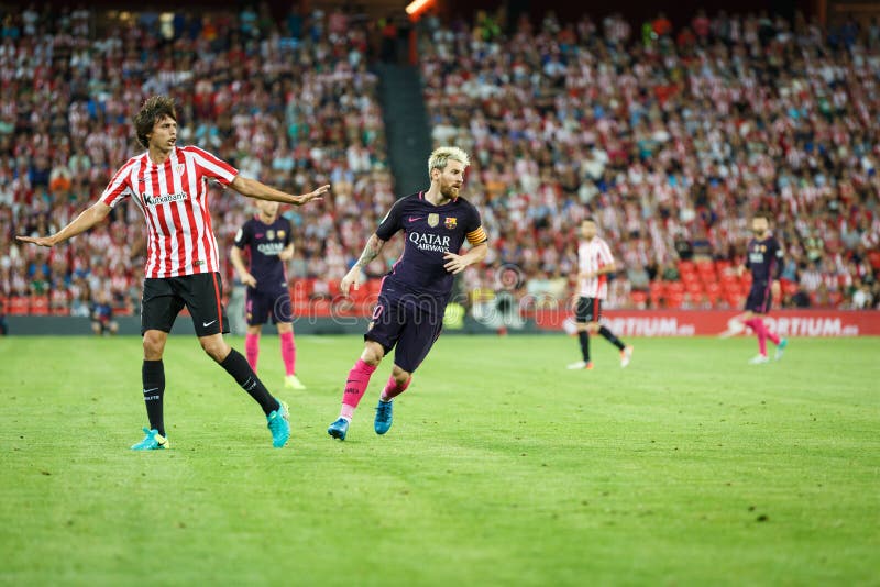 BILBAO, SPAIN - AUGUST 28: Lionel Messi, FC Barcelona player, and Ander Iturraspe, Bilbao player, in the the match between Athletic Bilbao and FC Barcelona, celebrated on August 28, 2016 in Bilbao, Spain