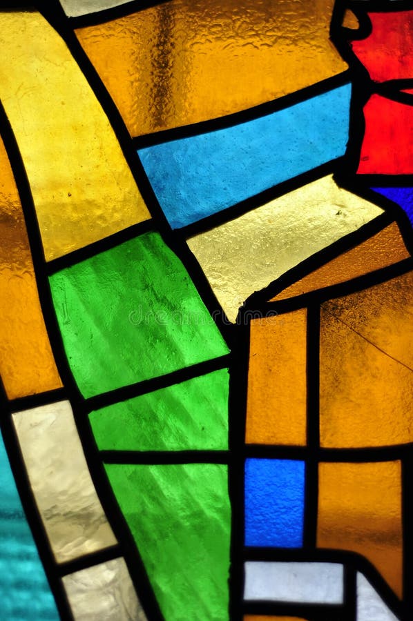 Image of a multicolored stained glass window with irregular block pattern. Image of a multicolored stained glass window with irregular block pattern.